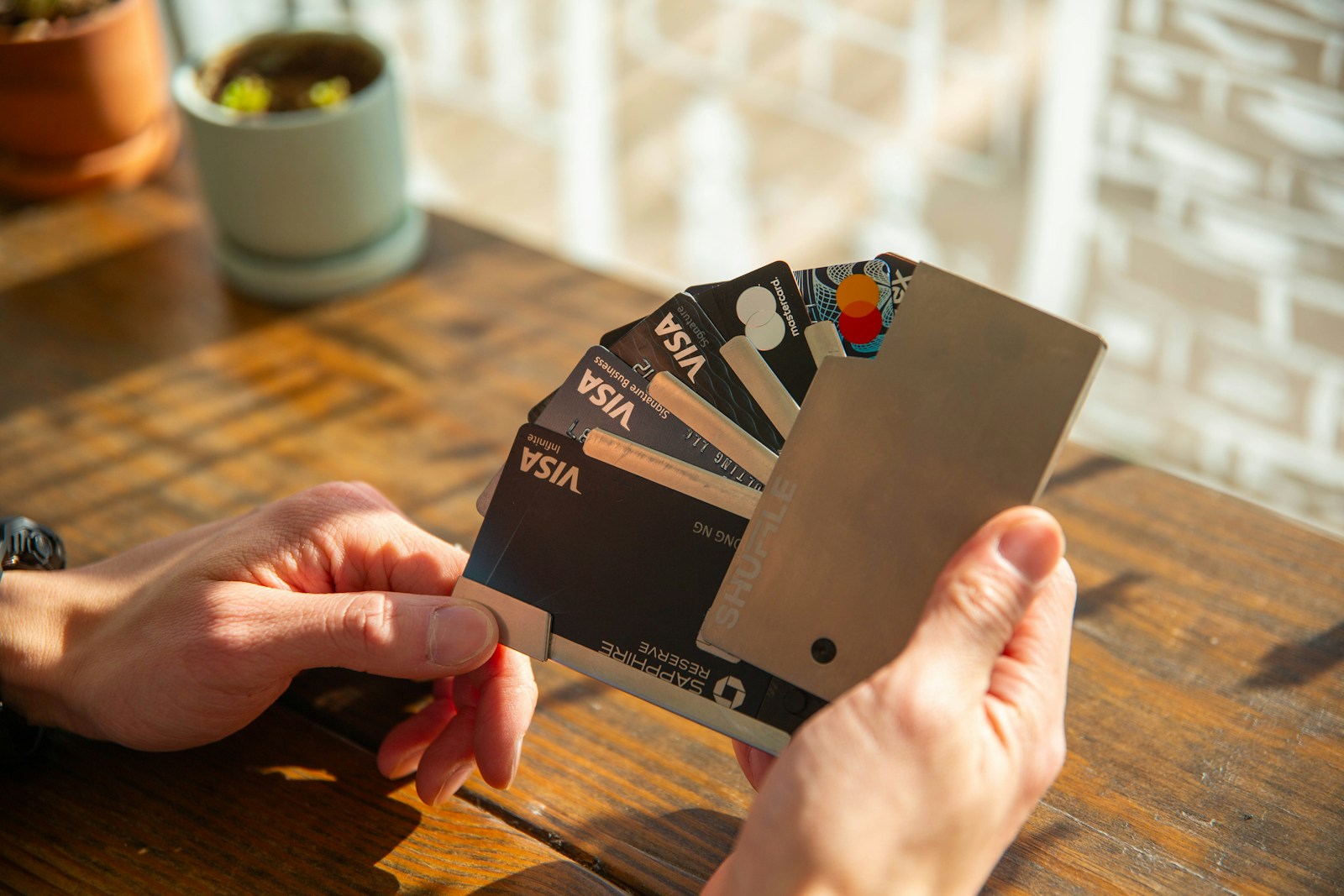 a person holding a credit card in their hand